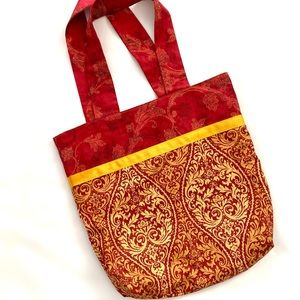 Hand-crafted tote made from recycled fabric.